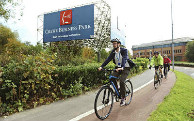 Cyclists passing Crewe Business Park