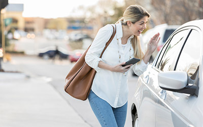 Woman greets ride share driver